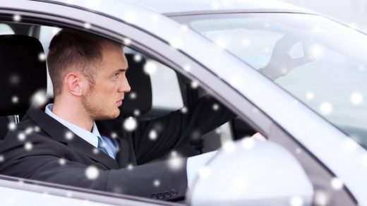 Business professional seated in the back of a chauffeur-driven car in Dubai