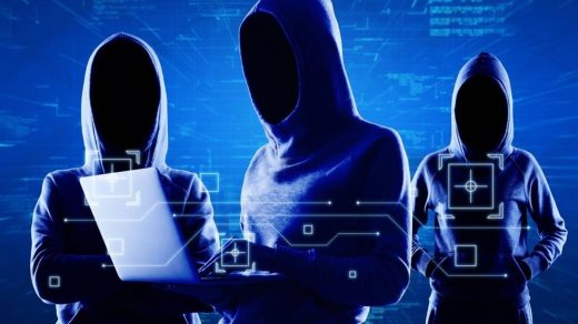 Hooded figures representing cybersecurity threats targeting corporate data