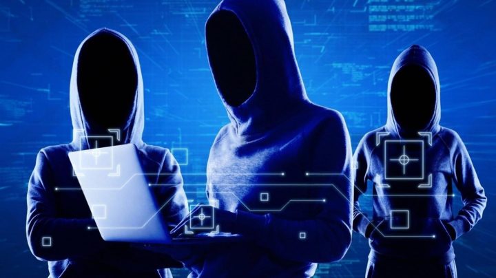 Hooded figures representing cybersecurity threats targeting corporate data